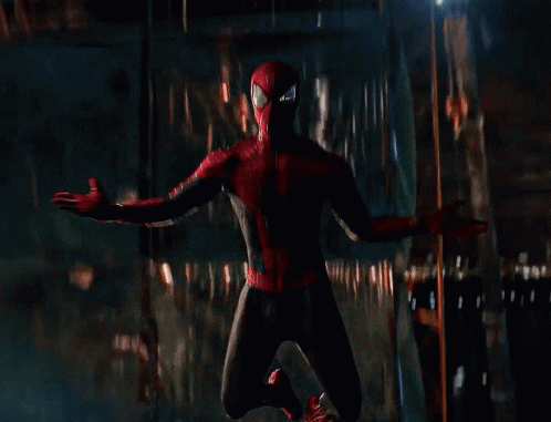 A Person In A Spiderman Costume Is Flying Through The Air GIF