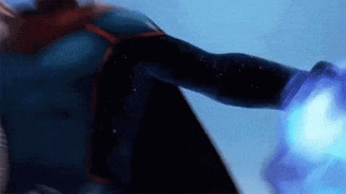 A Person In A Superhero Costume Is Holding A Blue Object GIF