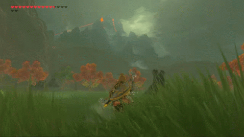 A Person In A Video Game Is Standing In A Field With Mountains In The Background GIF