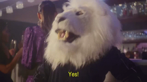 A Person In A White Lion Mask Says Yes GIF
