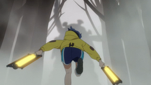 A Person In A Yellow Jacket And Blue Shorts Is Running Through A Forest GIF