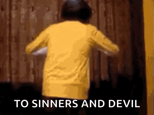 A Person In A Yellow Shirt Is Dancing With The Words To Sinners And Devil Behind Them GIF