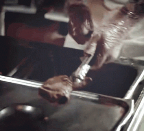 A Person Is Cooking A Piece Of Meat In A Frying Pan GIF