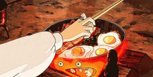 Person Cooking Eggs And Bacon With Chopsticks GIF