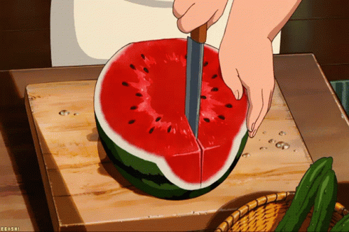 A Person Is Cutting A Watermelon On A Cutting Board With A Knife GIF
