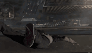 A Person Is Doing A Handstand In A Dark Area GIF