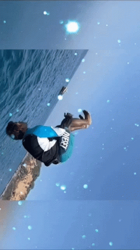 A Person Is Doing A Trick In The Water And They Are Wearing A Shirt That Says " Target " GIF