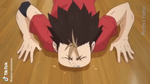 A Person Is Doing Push Ups On A Wooden Floor . GIF