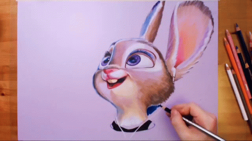 A Person Is Drawing A Bunny With A Pencil On A Piece Of Paper GIF