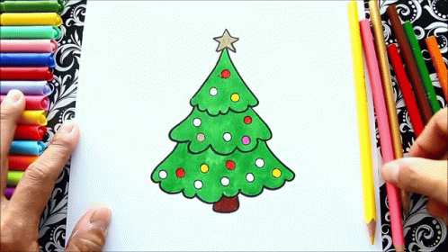 A Person Is Drawing A Christmas Tree On A Piece Of Paper GIF