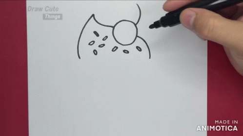 A Person Is Drawing A Drawing With A Marker On A Piece Of Paper GIF