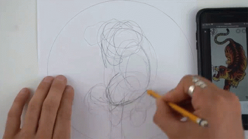 A Person Is Drawing A Picture Of A Tiger With A Pencil GIF