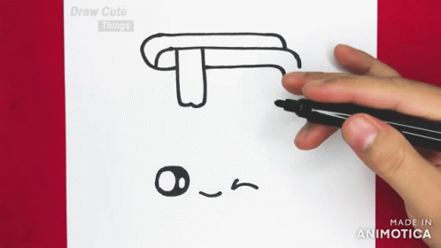 A Person Is Drawing A T On A Piece Of Paper With A Marker GIF