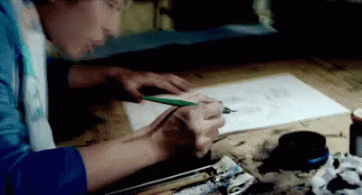 A Person Is Drawing With A Pencil On A Piece Of Paper . GIF