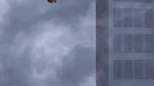 A Person Is Falling Through The Air With A Basketball On Their Head With The Number 10 On It GIF