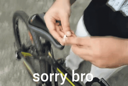 A Person Is Fixing A Bicycle With The Words Sorry Bro Below GIF