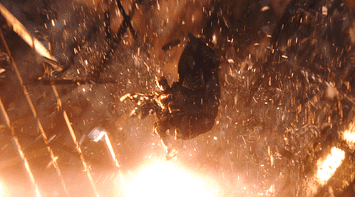 A Person Is Flying Through The Air With A Lot Of Sparks Coming Out Of It GIF