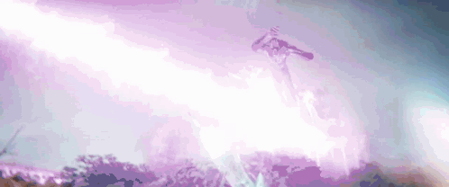 A Person Is Flying Through The Air With A Purple Lightning Bolt Coming From The Sky . GIF