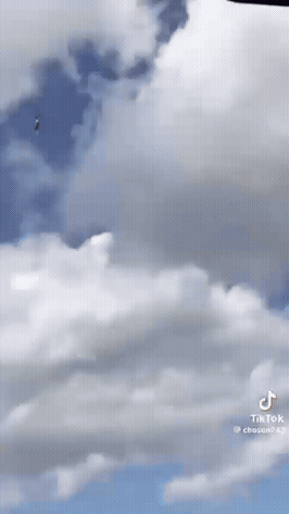 A Person Is Flying Through The Air With A Tiktok Watermark GIF