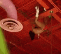a person is hanging from the ceiling of a building