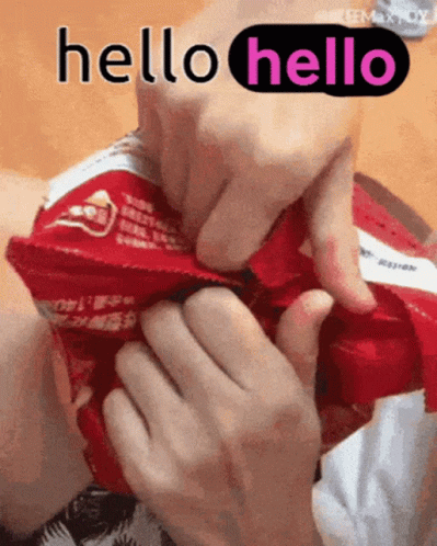 A Person Is Holding A Bag Of Chips And Says Hello GIF