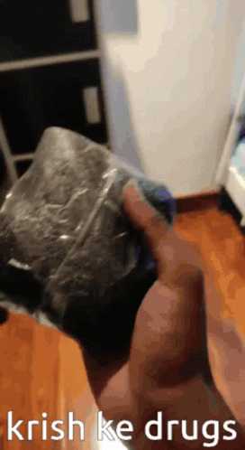 a person is holding a bag that says ' krish ke drugs ' on the bottom