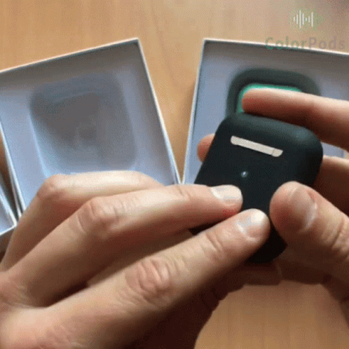 A Person Is Holding A Black Item In Front Of A Box That Says Colorpack GIF