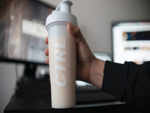 A Person Is Holding A Bottle Of Ctrl Meal Replacement GIF