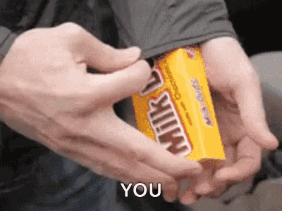 A Person Is Holding A Box Of Milky Way Candy And Says You GIF