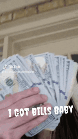 A Person Is Holding A Bunch Of Money And The Caption Says I Got Bills Baby GIF