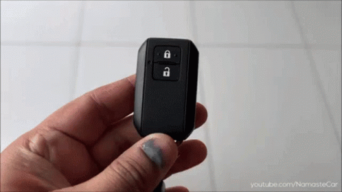A Person Is Holding A Car Key Fob With A Youtube.com Logo In The Corner GIF