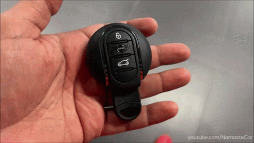 A Person Is Holding A Car Key In Their Hand With Youtube.com/namastecar Written On The Bottom GIF