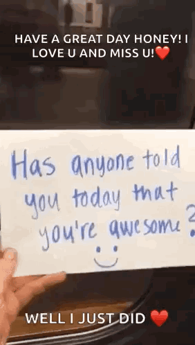 A Person Is Holding A Card That Says `` Has Anyone Told You Today That You 'Re Awesome ? `` GIF