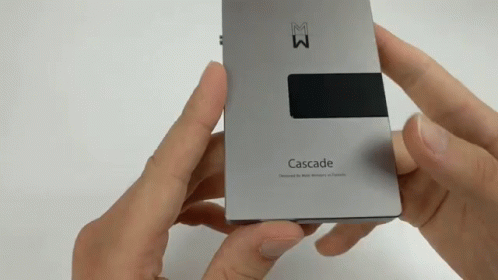 A Person Is Holding A Cascade Device In Their Hand GIF
