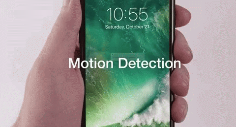 A Person Is Holding A Cell Phone That Says Motion Detection GIF