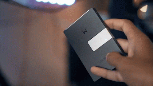 A Person Is Holding A Cisco Device In Their Right Hand GIF