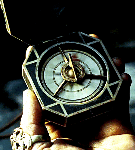 A Person Is Holding A Compass In Their Hand And It Shows The Time As Almost 3:00 GIF