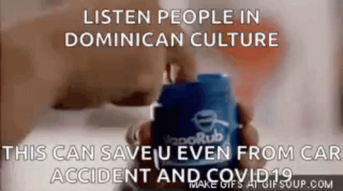 A Person Is Holding A Container Of Vaporub In Their Hands . GIF