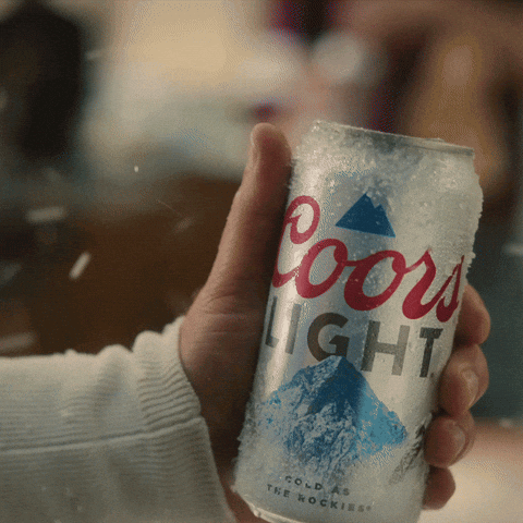 A Person Is Holding A Coors Light Can In Their Hand GIF