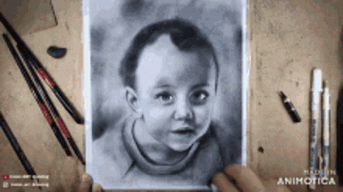 A Person Is Holding A Drawing Of A Child 'S Face GIF