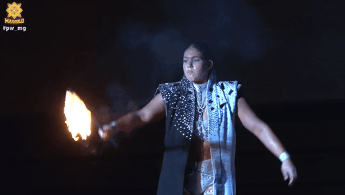 A Person Is Holding A Fireball In Front Of A Sign That Says ' Captain Star ' GIF