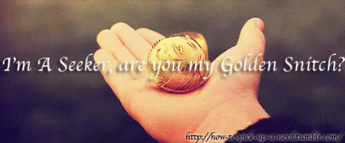 A Person Is Holding A Golden Snitch In Their Hand GIF