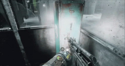 A Person Is Holding A Gun In A Video Game And A Light Is Coming Out Of A Door . GIF