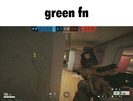 a person is holding a gun in a video game and the word green is on the bottom .
