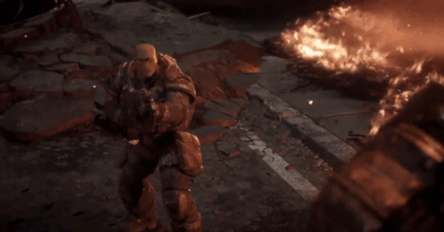 A Person Is Holding A Gun In Front Of A Bright Light . GIF