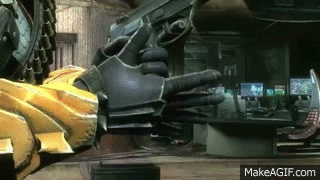 A Person Is Holding A Gun In Their Hand In A Room . GIF