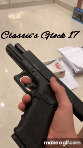 A Person Is Holding A Gun With The Words Classii 'S Glock 17 On The Bottom GIF