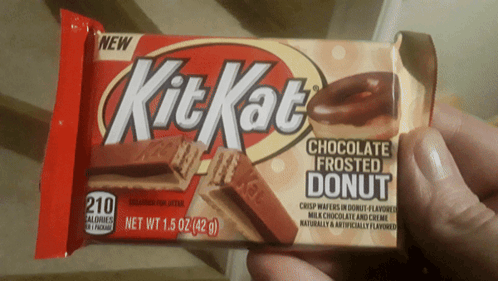 A Person Is Holding A Kit Kat Chocolate Frosted Donut Bar GIF