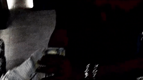 A Person Is Holding A Large Stack Of Money In Their Hand . GIF