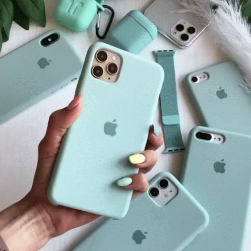 A Person Is Holding A Light Blue Apple Phone In Their Hand GIF